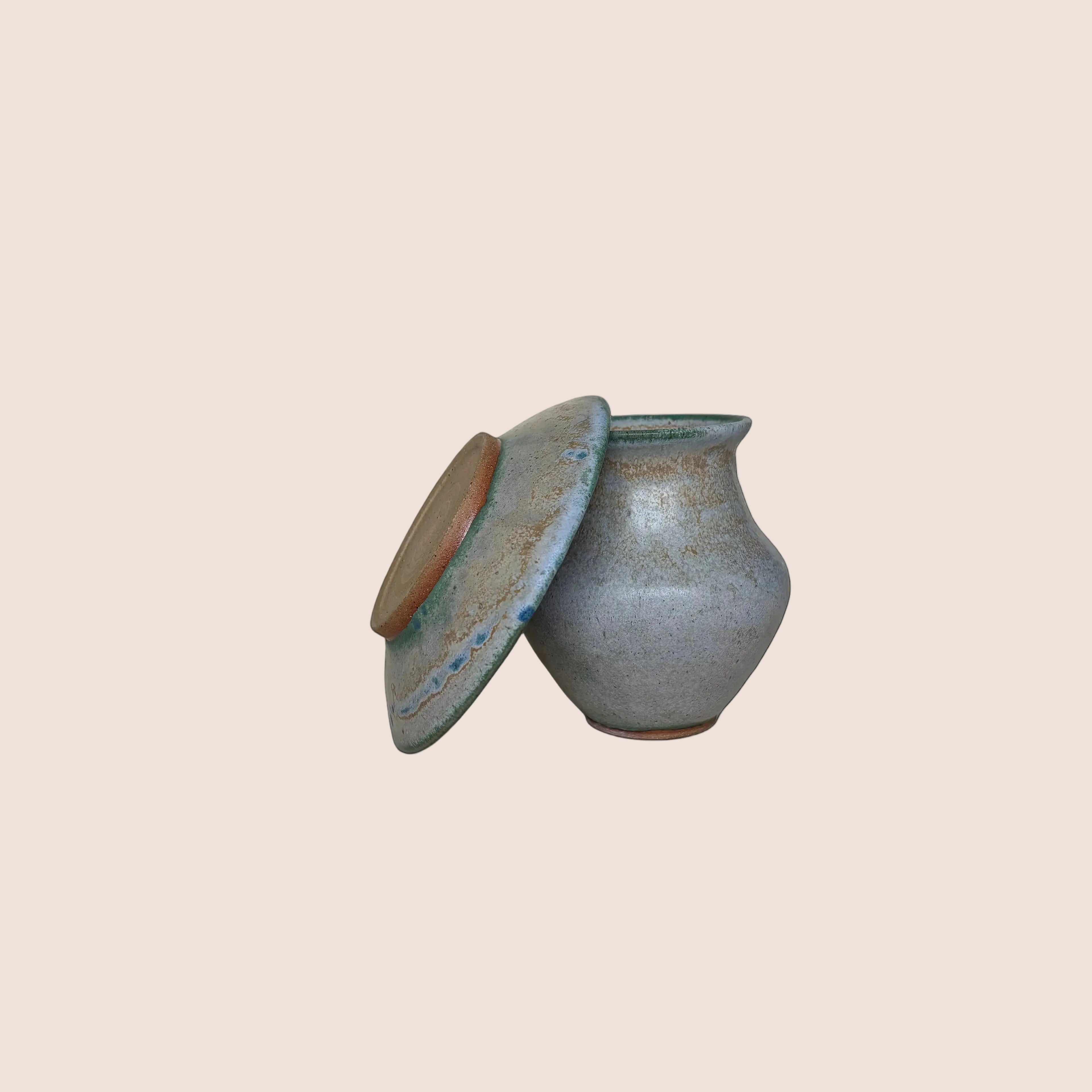 Small gray ceramic vase and matching plate on a light background, Stephanie Garrigan Ceramics, Ireland Based Ceramic Artist, Ireland Based Pottery Artists, Ireland Pottery.