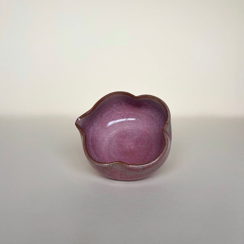 Pink with green accents ceramic matcha bowl with a spout on cream background showing inside of bowl. Pottery bowl  Handmade in Ireland. Wheel Thrown Pottery and Ceramic. 