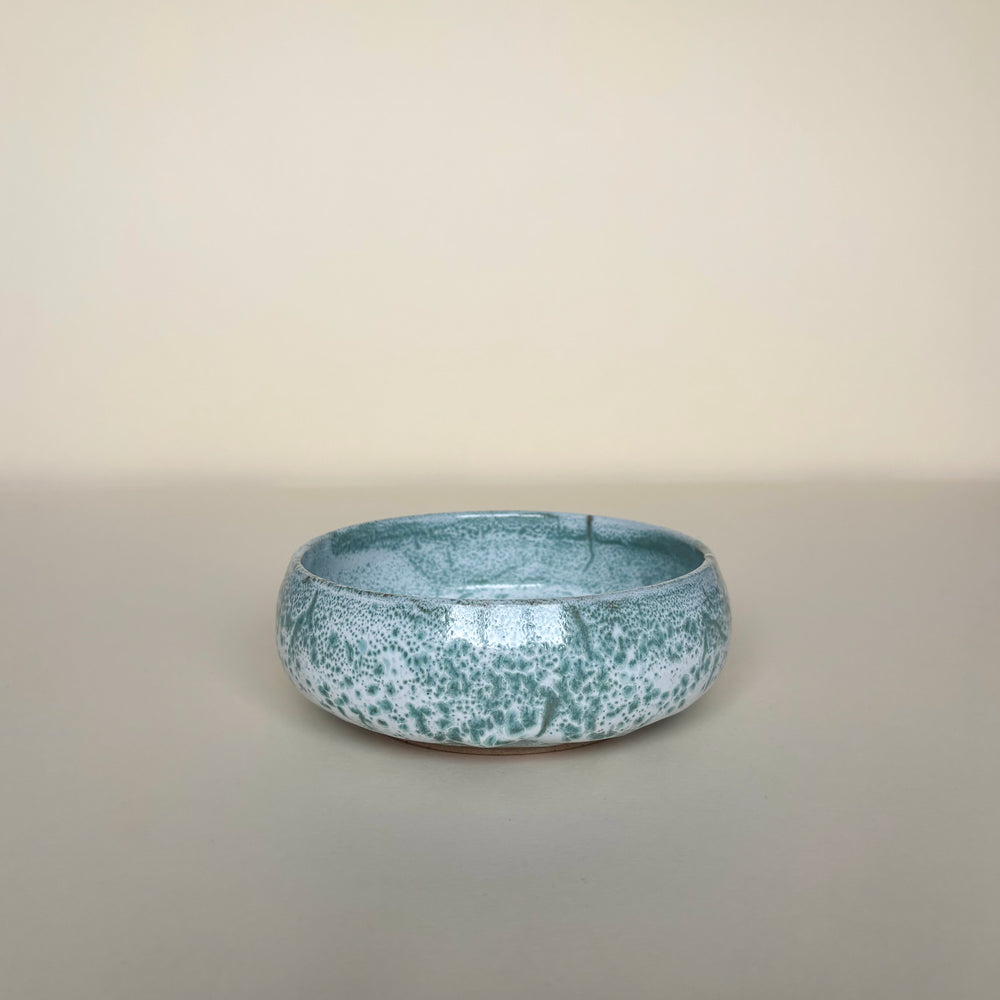 Ceramic bowl with speckled sea foam like pattern on a cream background. Pottery bowl  Handmade in Ireland. Wheel Thrown Pottery and Ceramic. 