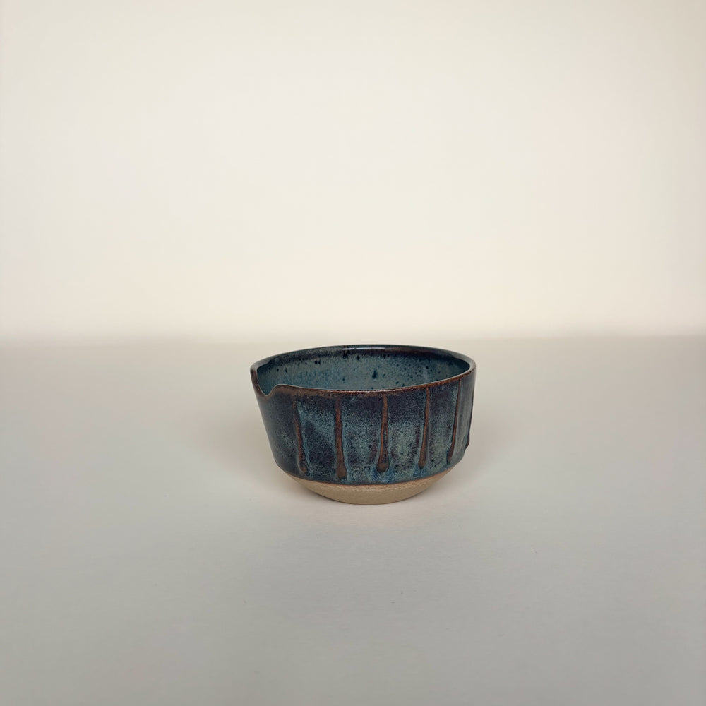Ceramic bowl with textured surface on a cream  background. Pottery bowl  Handmade in Ireland. Wheel Thrown Pottery and Ceramic. 