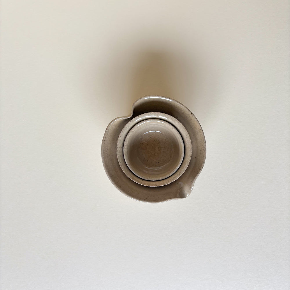 Handmade Ceramic Pots, Natural clay colour, shiny finish, stackable. On a cream background. Pottery Handmade in Ireland. Wheel Thrown Pottery and Ceramic.