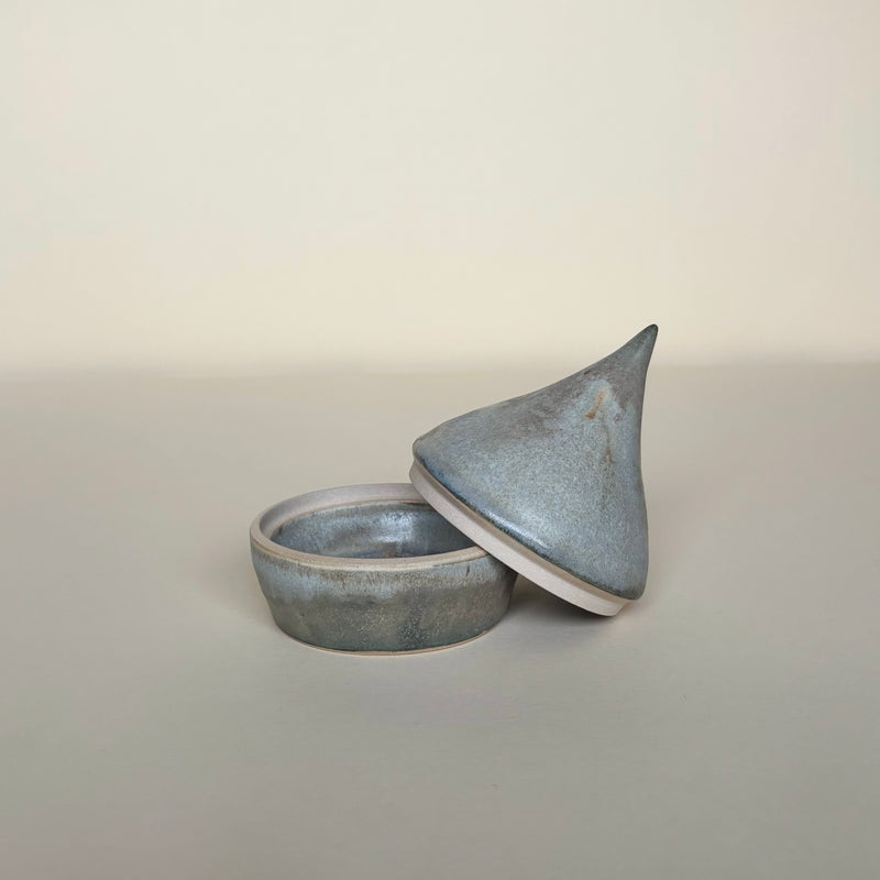 Ceramic container with a pointed lid on a cream  background. Pottery Handmade in Ireland. Wheel Thrown Pottery and Ceramic. 