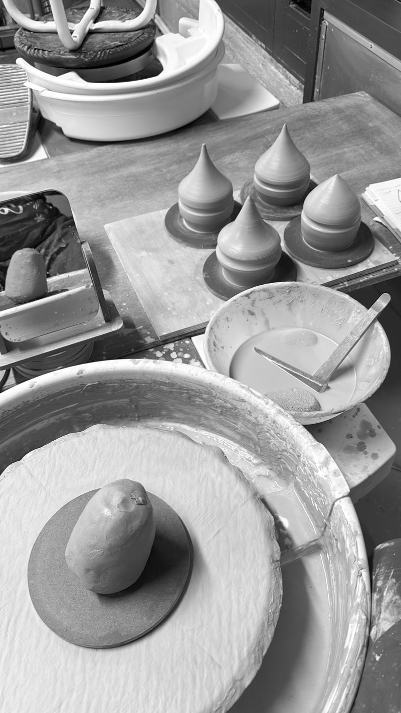 Pottery wheel with clay on a workbench in a pottery studio